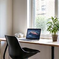 Clean, organized home office with ergonomic furniture and intentional lighting, symbolizing productivity habits.